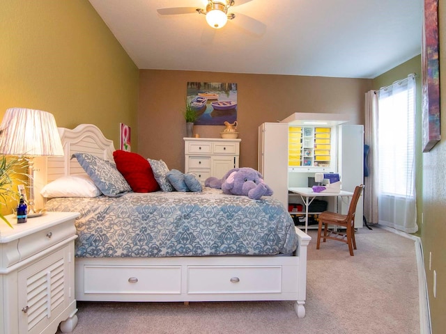 bedroom with ceiling fan and light colored carpet