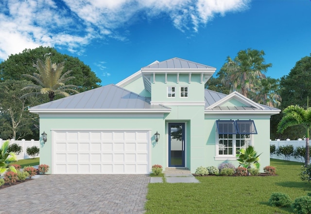 view of front of property featuring a front lawn and a garage