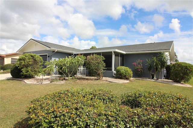 ranch-style home featuring a front yard