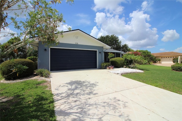 ranch-style home with a front lawn and a garage