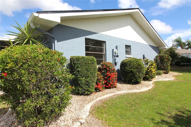 view of home's exterior featuring a yard