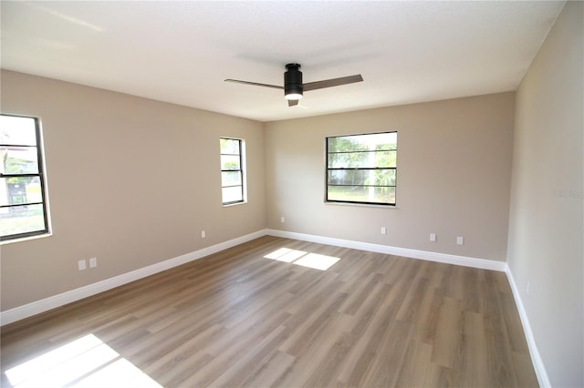 unfurnished room with light hardwood / wood-style floors and ceiling fan