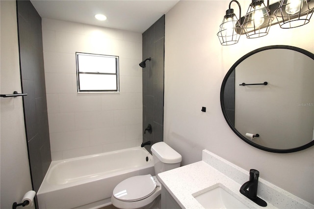 full bathroom with toilet, tiled shower / bath combo, and vanity