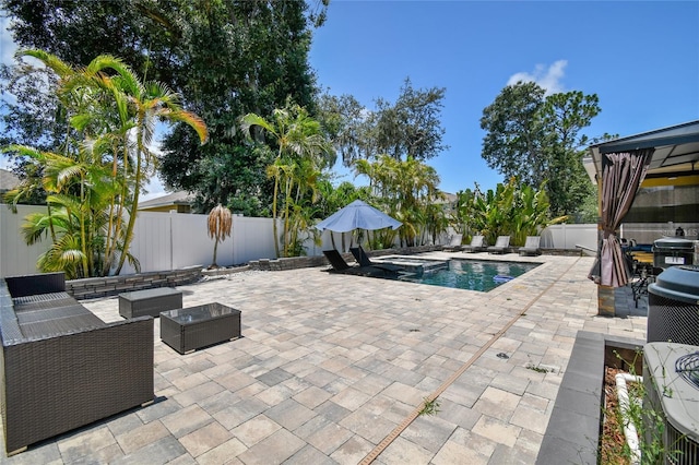 view of pool featuring area for grilling, an outdoor living space, and a patio