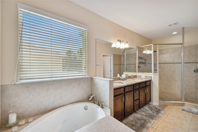 bathroom with tile floors, dual bowl vanity, and plus walk in shower