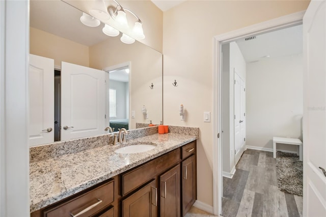 bathroom featuring vanity and wood-type flooring