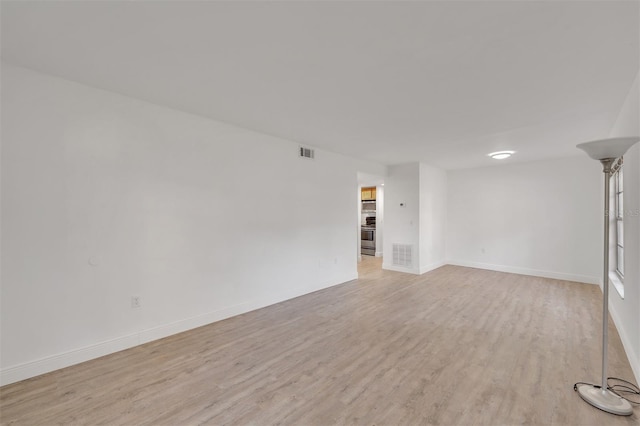 empty room featuring light hardwood / wood-style floors