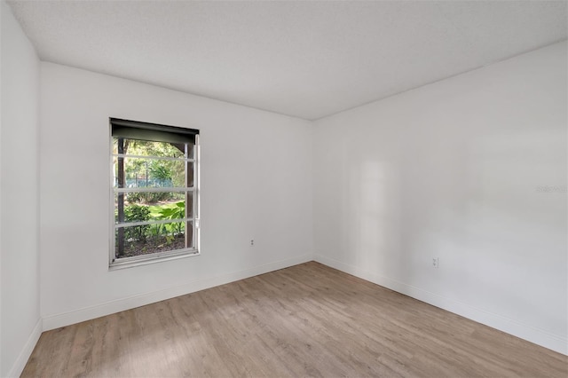 empty room with light wood-type flooring