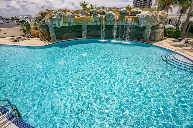 view of pool featuring a patio and pool water feature