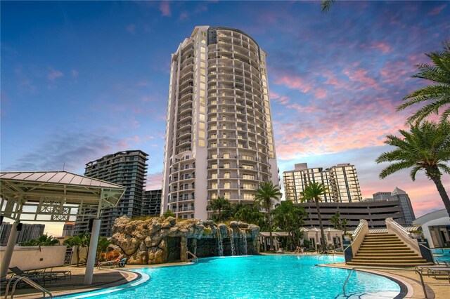 view of pool at dusk