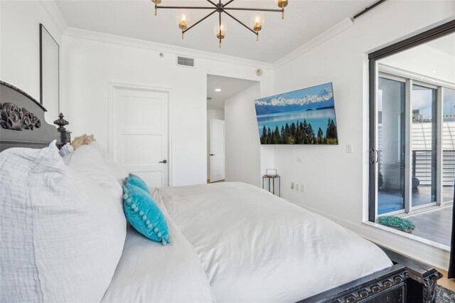 bedroom featuring ornamental molding, hardwood / wood-style flooring, access to outside, and a chandelier