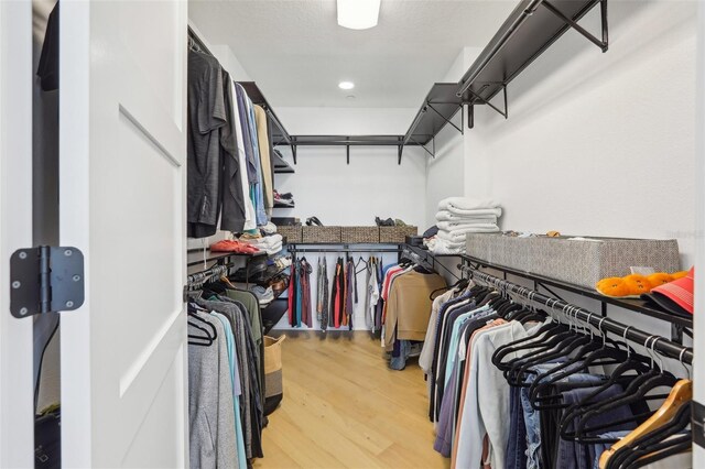 walk in closet featuring hardwood / wood-style floors