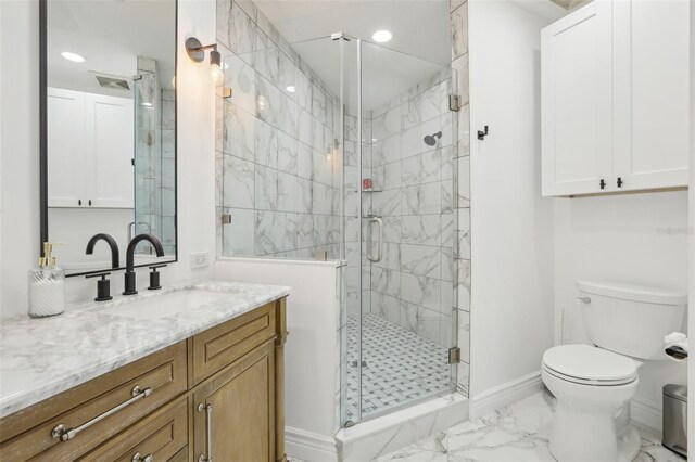 bathroom featuring vanity, toilet, and walk in shower