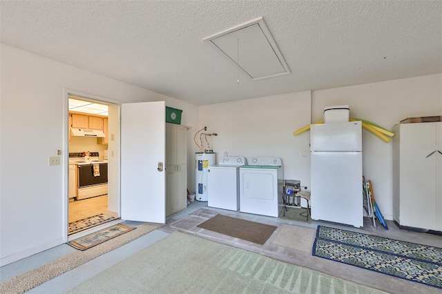 garage with white fridge, water heater, and washer and clothes dryer