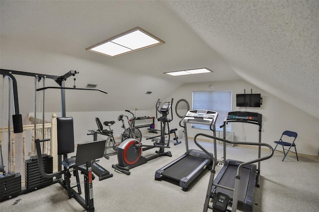 exercise room with light carpet, vaulted ceiling, and a textured ceiling