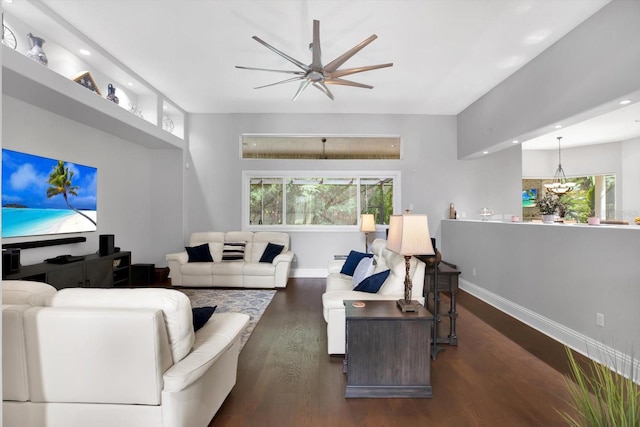 living room with ceiling fan, a healthy amount of sunlight, and dark hardwood / wood-style flooring