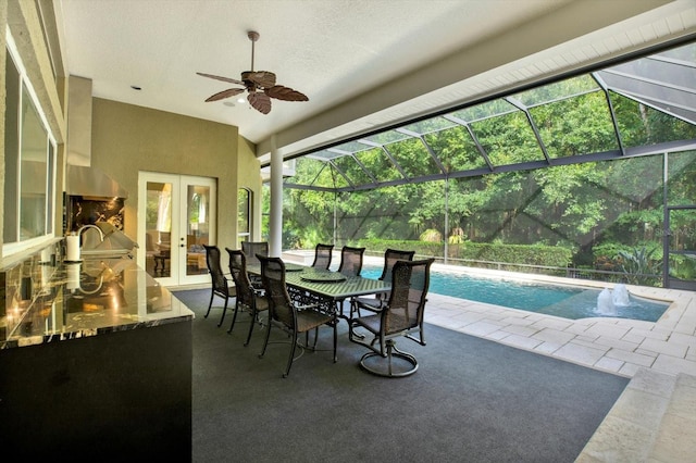 sunroom with lofted ceiling and french doors