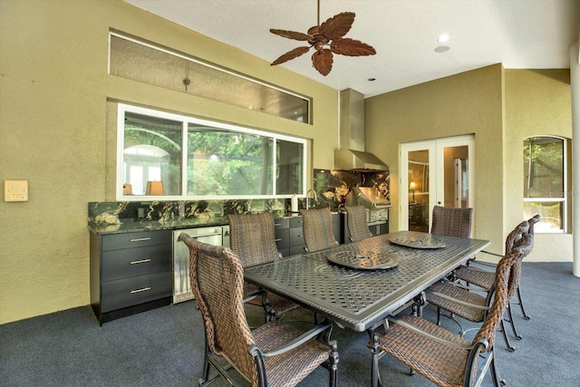 interior space with ceiling fan