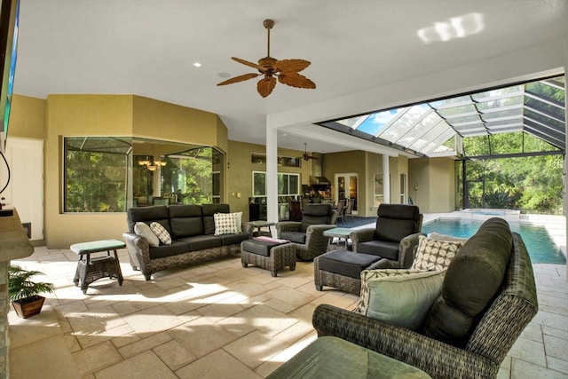 view of patio with ceiling fan, outdoor lounge area, and a lanai