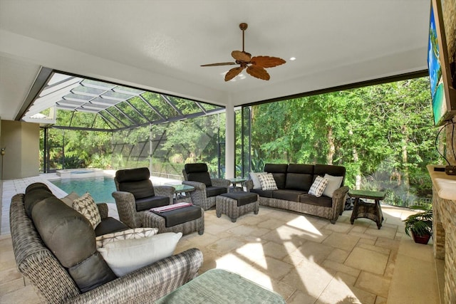 sunroom featuring ceiling fan