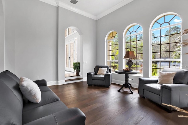 interior space featuring crown molding and dark hardwood / wood-style flooring