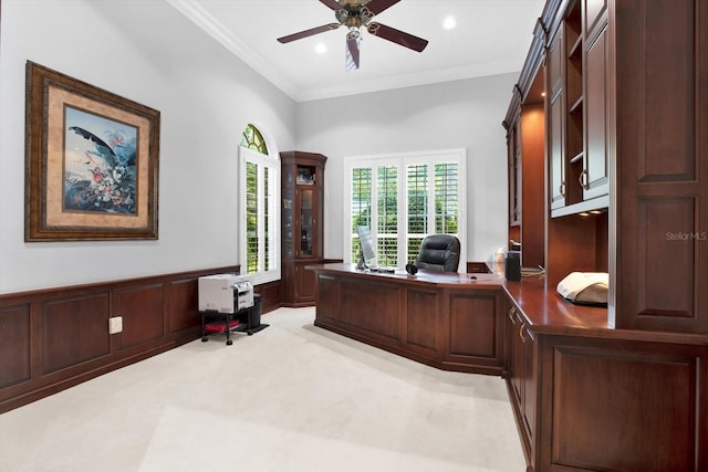 office featuring crown molding, ceiling fan, and light carpet