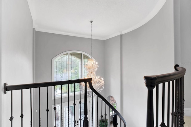 interior space featuring an inviting chandelier and ornamental molding