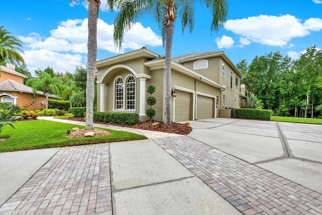 view of property exterior with a garage and a lawn