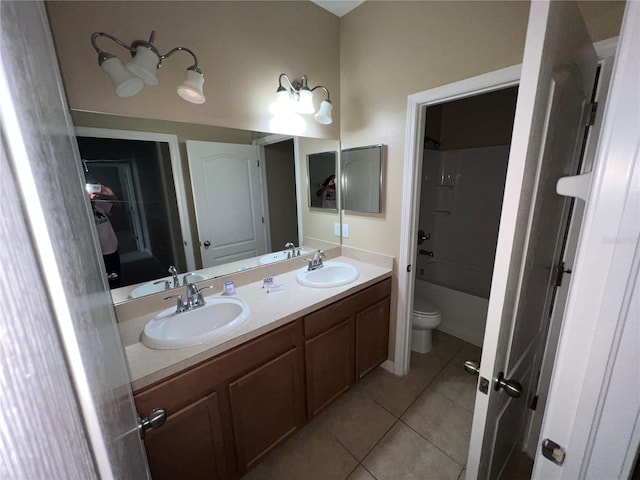 full bathroom featuring tile patterned floors, vanity, toilet, and bathing tub / shower combination