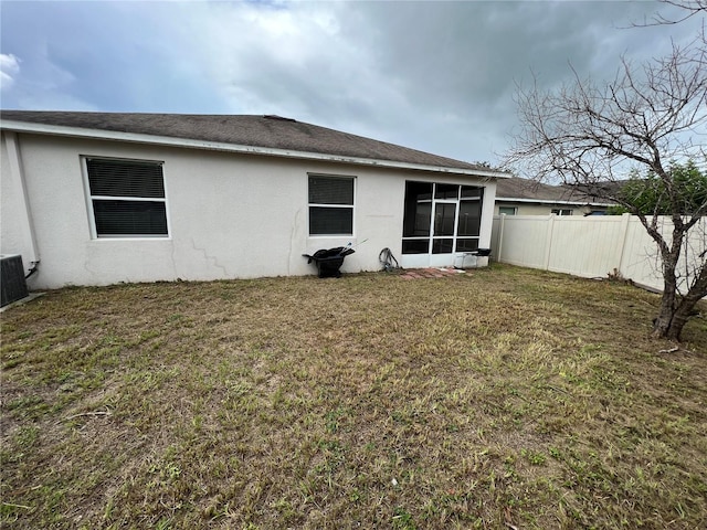 rear view of house with a lawn