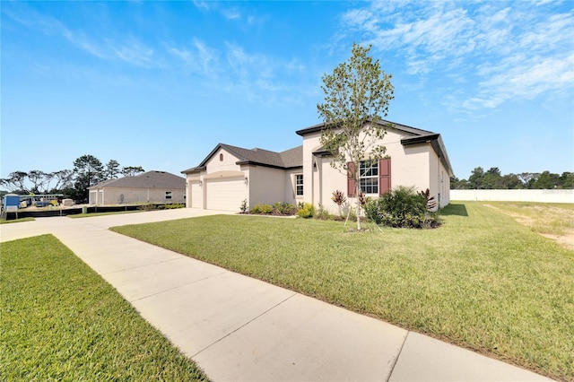 view of front facade featuring a front lawn and a garage