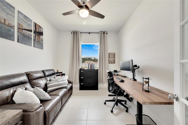 home office with ceiling fan and light tile flooring