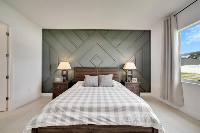 bedroom featuring light tile floors