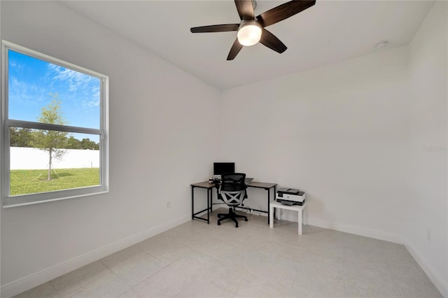 office with light tile flooring and ceiling fan