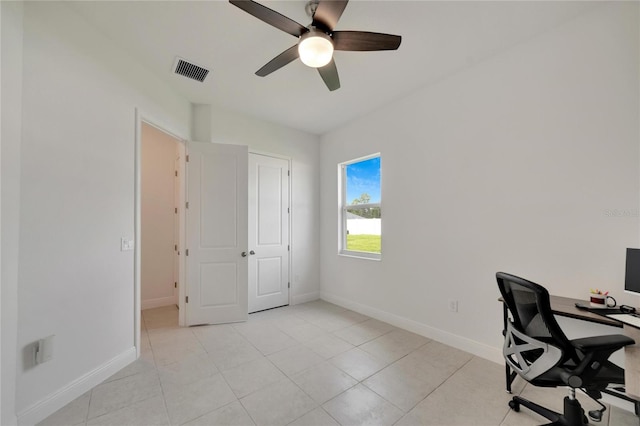 tiled home office with ceiling fan