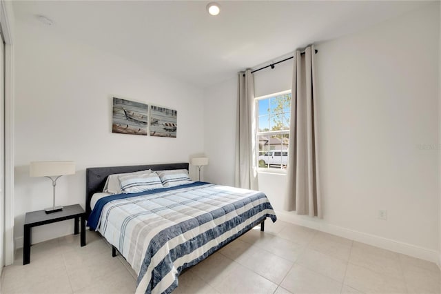 bedroom with light tile flooring