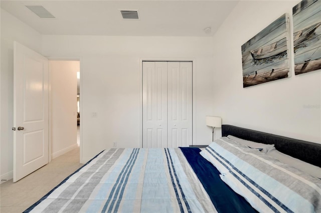 tiled bedroom featuring a closet