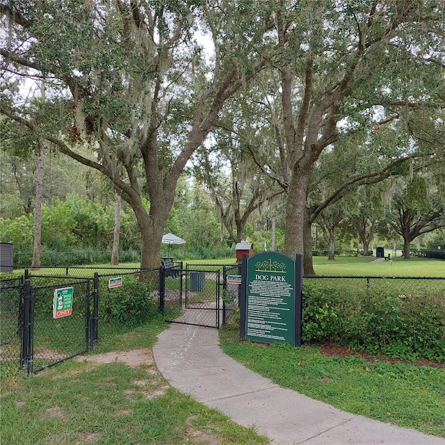 view of property's community with a lawn