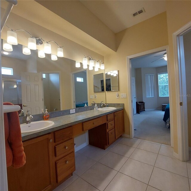 bathroom with ceiling fan, tile patterned floors, and vanity