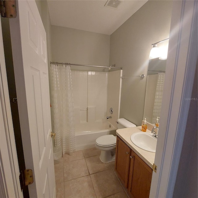 full bathroom with toilet, vanity, tile patterned floors, and shower / bath combo