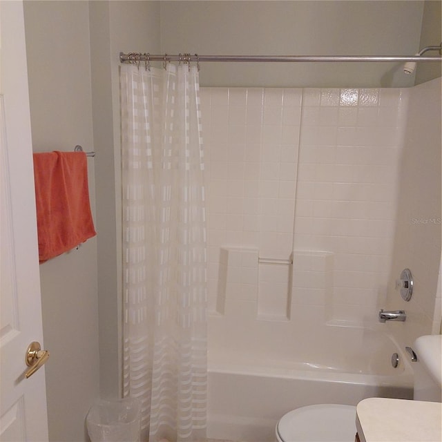 bathroom with toilet and shower / bath combination with curtain