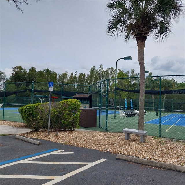 exterior space featuring tennis court