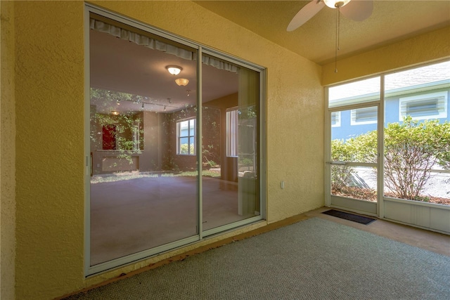 8049 Sanguinelli Rd, Land O Lakes, FL 34637 - unfurnished sunroom with ceiling fan