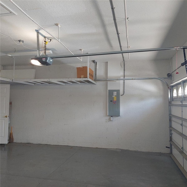 8049 Sanguinelli Rd, Land O Lakes, FL 34637 - garage featuring electric panel and a garage door opener