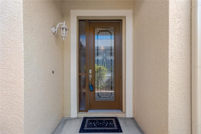 8049 Sanguinelli Rd, Land O Lakes, FL 34637 - property entrance with stucco siding