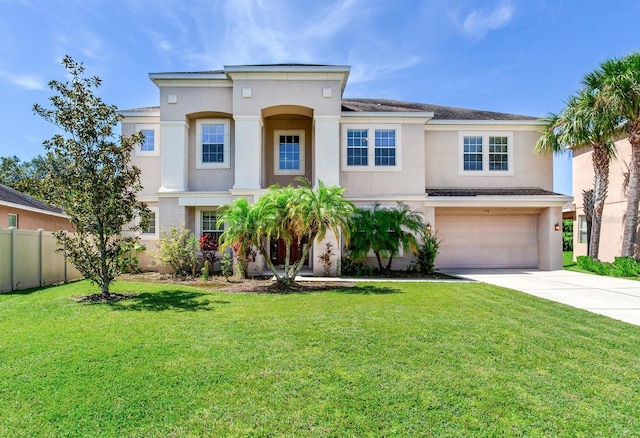 view of front of property featuring a garage and a front yard