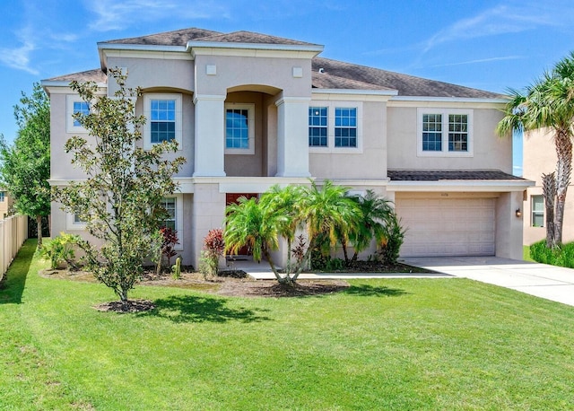 view of front of property featuring a garage and a front yard