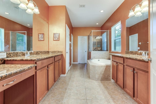 bathroom with tile flooring, vanity with extensive cabinet space, and shower with separate bathtub