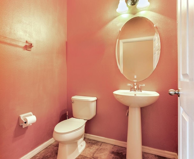 bathroom with tile floors and toilet