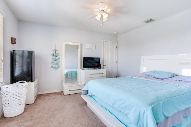 bedroom featuring light carpet and ceiling fan